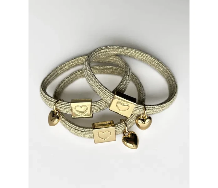 noordliving hiuslenkki rannekoru kulta glitter kuva